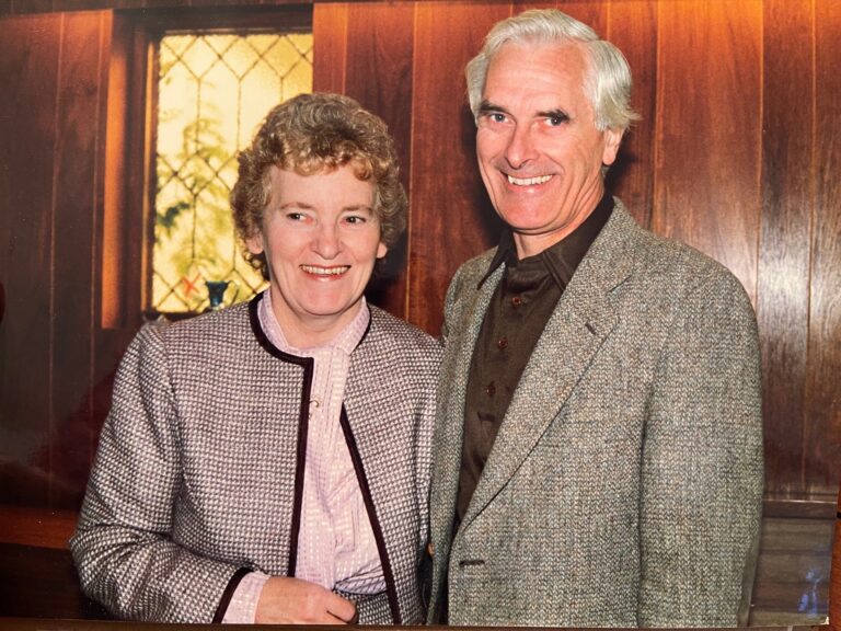 Scanned photo of Joan and Leonard Leece, smiling at the camera.